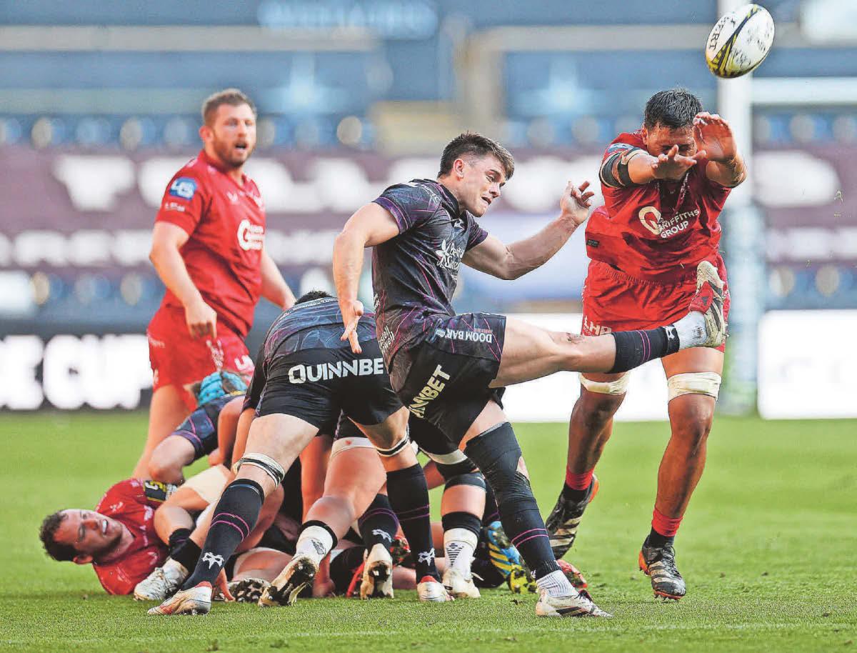 SAM BACKS PLANS TO AXE ONE TEAM