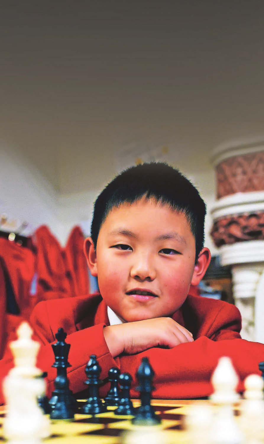 Knight school! Young chess wizard flying flag for Wales