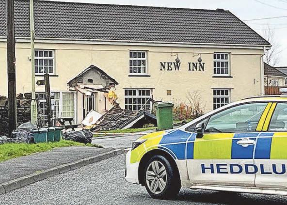 Man arrested after pub rammed by bulldozer