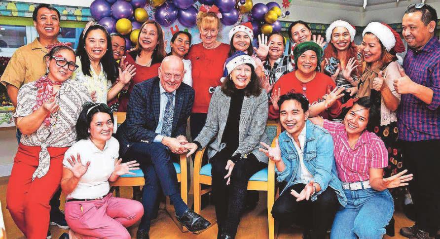 Couple hand out gifts to mark 40 years of caring