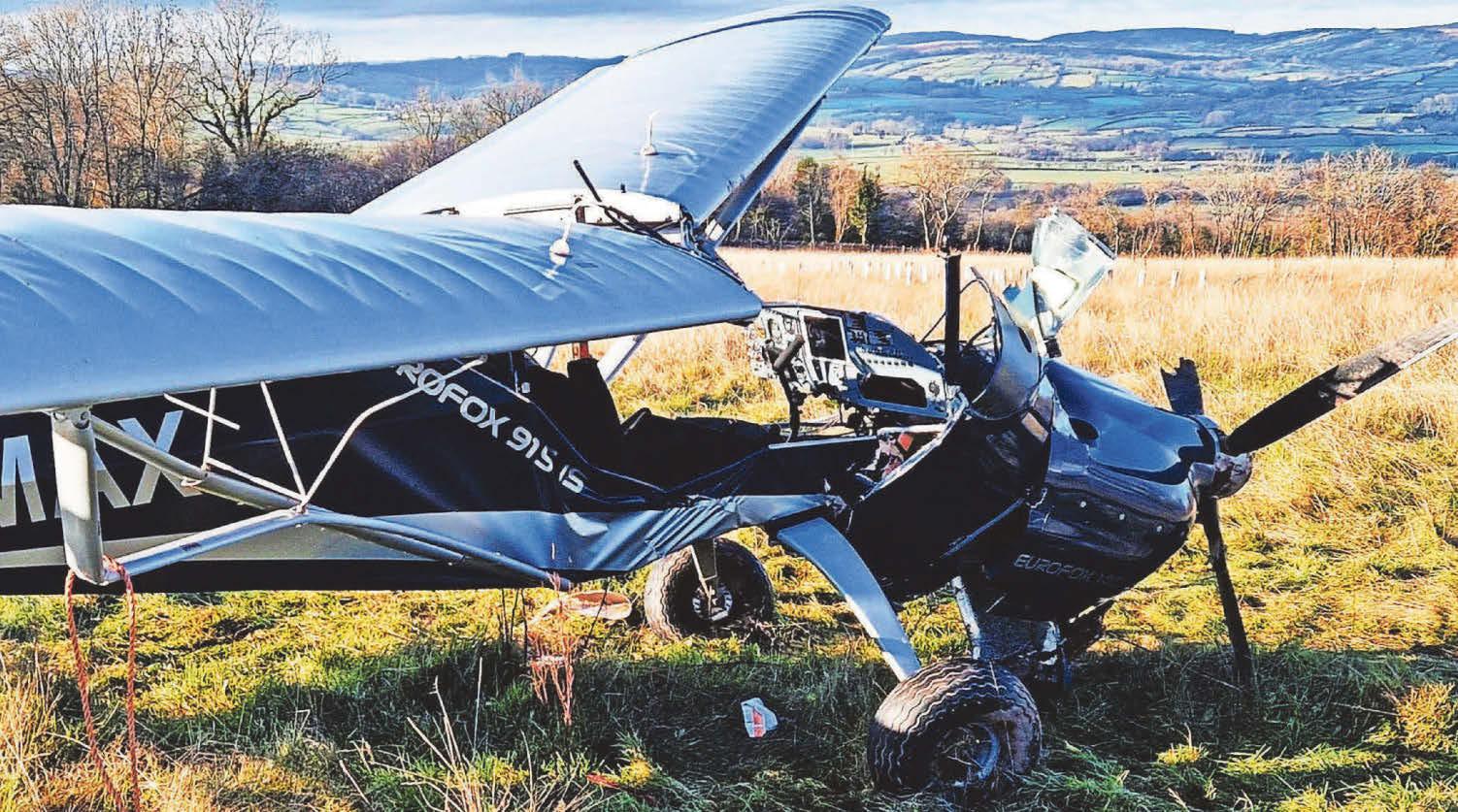 Pilot cut from his light aircraft after crash-landing in field
