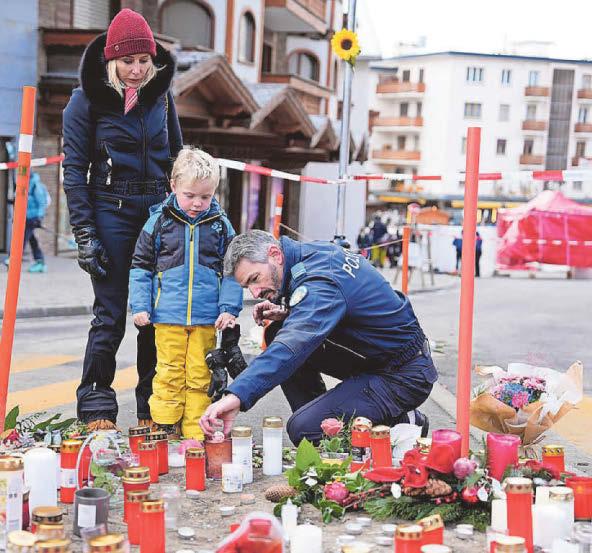 Candle flares started fire, say Swiss investigators