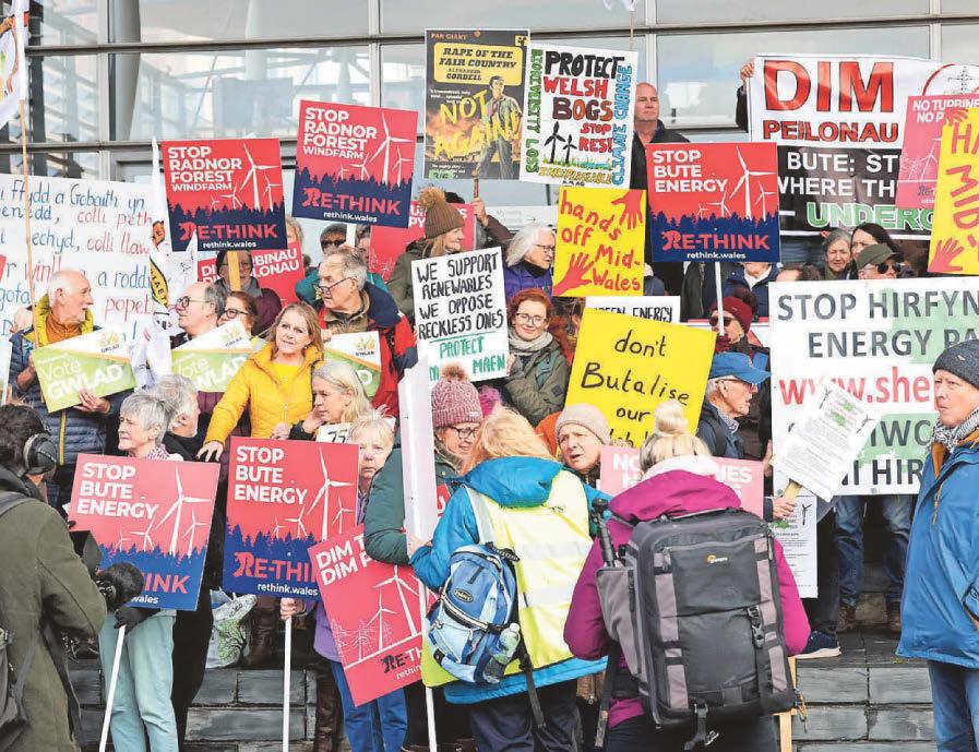 Protesters rally against rural wind farm plans