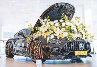 Event at car dealership helps to drive progress