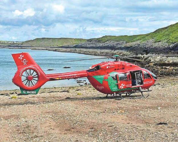 Air ambulance lands on beach to fly man with broken arm to hospital