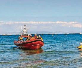SHARP-EYED BEACHGOERS RAISE ALARM FOR RESCUE