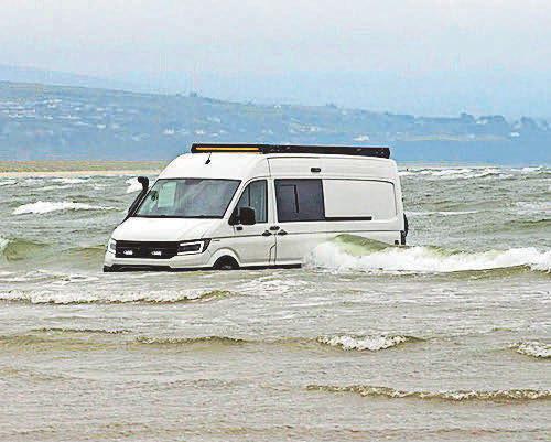Not again... three more vehicles swamped by sea