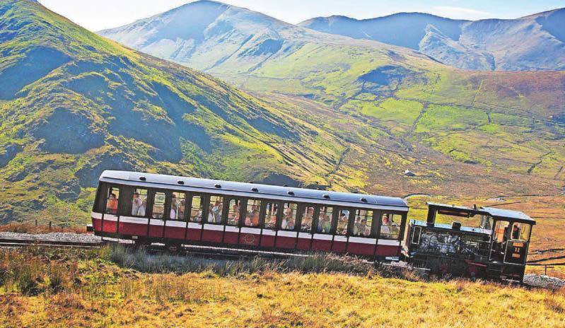 Cyclist spotted riding mountain rail tracks