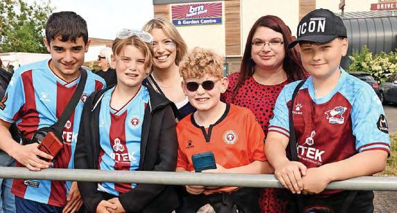 Iron fans celebrate promotion with players at victory bus tour