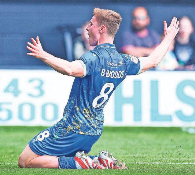 Woods' wonder goal secures Reds' status