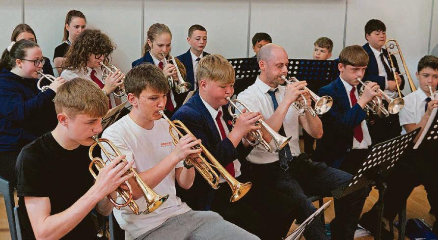 Students and staff tune in to create band harmony