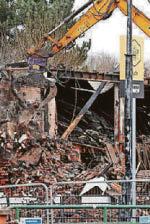 Bulldozers move onto fire-hit site