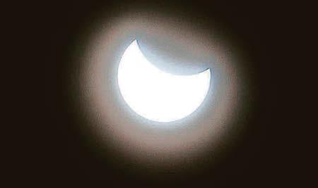 Skygazers gather for partial solar eclipse
