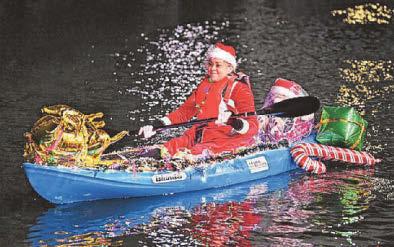 Santas swap sleighs for kayaks