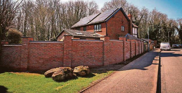 Row over wall that 'looks like a prison' on housing estate