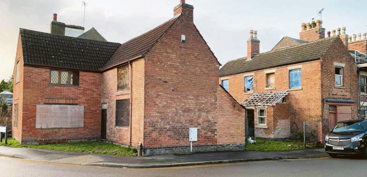 'Negligent' owner fined for letting homes slide