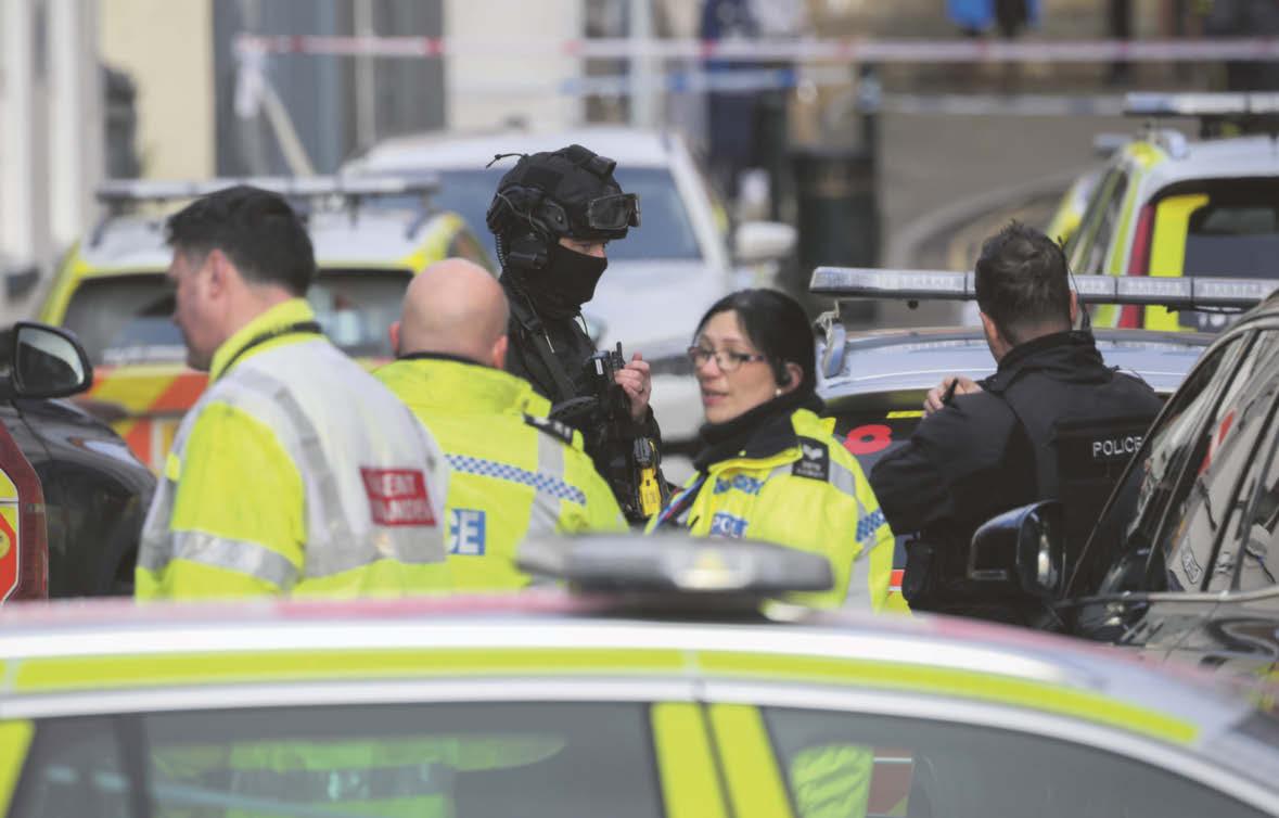 Man in rooftop stand-off with armed police in town centre