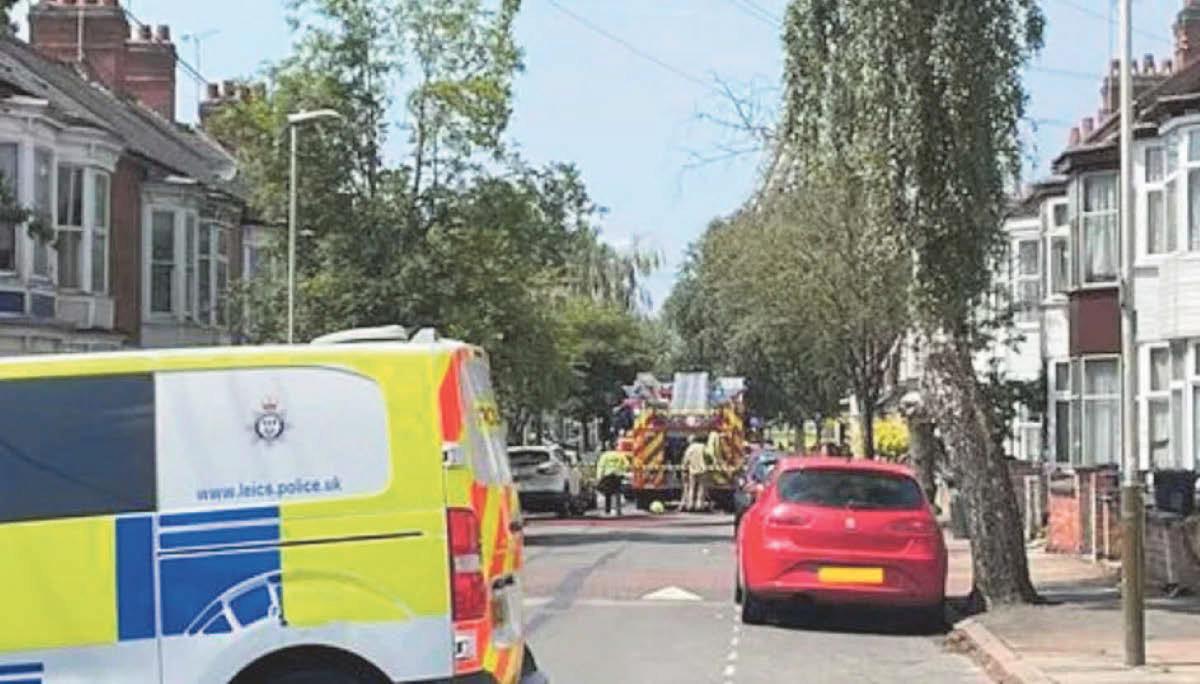 Road closes as crews tackle fire in four roof spaces in city