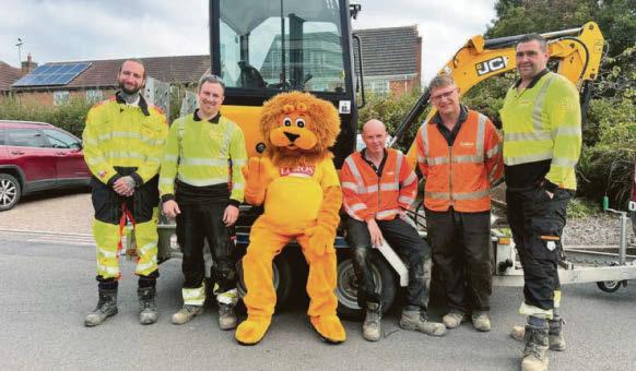 Volunteers help to fix hospice's drainage problems