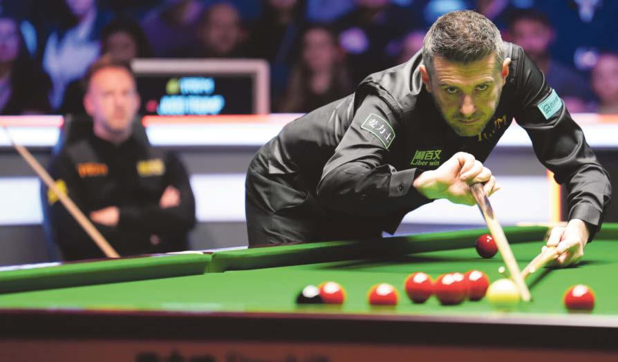 Selby holds nerve to take triple crown title