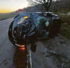 Two men injured as car flips onto roof