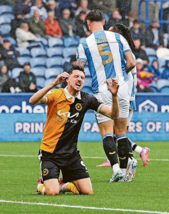 Brewers dig in to claim hard-fought away point against Terriers in the rain