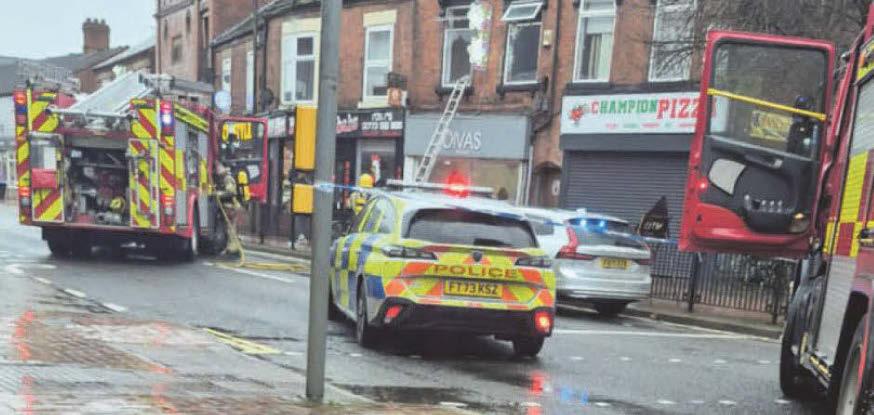 Two people taken to hospital after fire rips through three-storey building