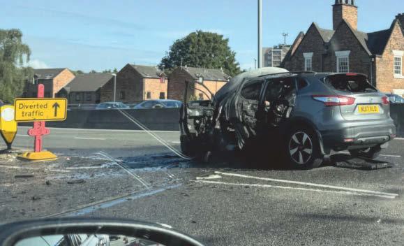 Fire crews tackled car fire on main route into city centre