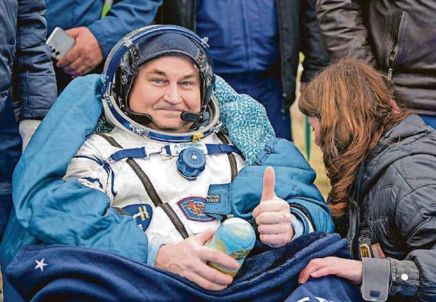 Astronauts return to Earth