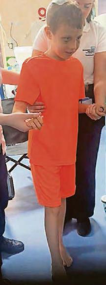 Boy takes first steps after accident