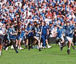 Pitch invasion by fans set to spark 'significant fine' for Blues