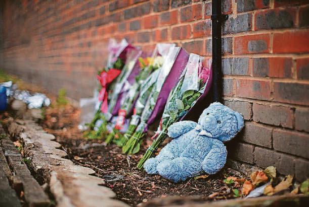 Floral tributes at scene of fatal house blaze