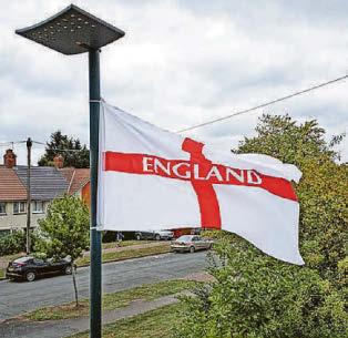PM backs patriotism - but flags come down