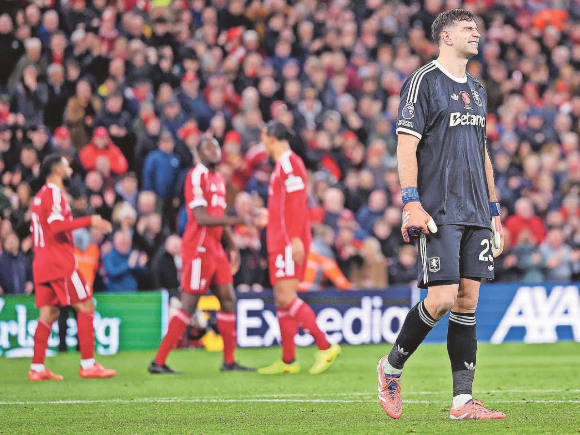 Emery holds his hands up over Emi's costly howler