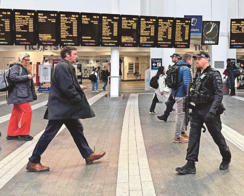 Armed cops patrol rail hub after stabbings