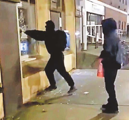 Hunt for activists who attacked bank