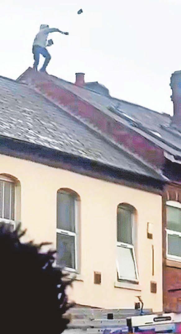 Man charged after roof tiles lobbed onto street