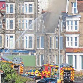 Murder inquiry after hotel blaze