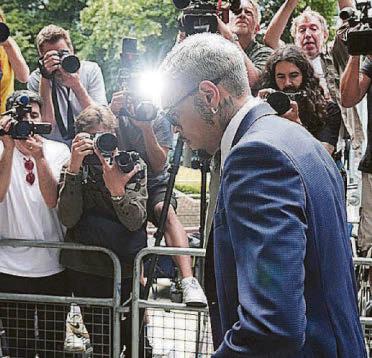 Singer's not guilty plea over 'bottle attack'