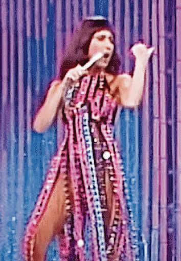 Sabrina turns back time in 70s Cher dress