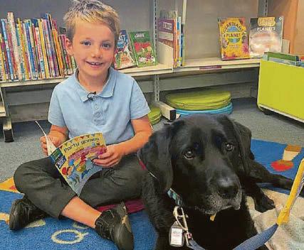 Kind Labrador Rafa helps kids to read