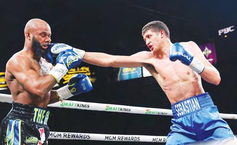 Fundora stops Booker to retain crowns