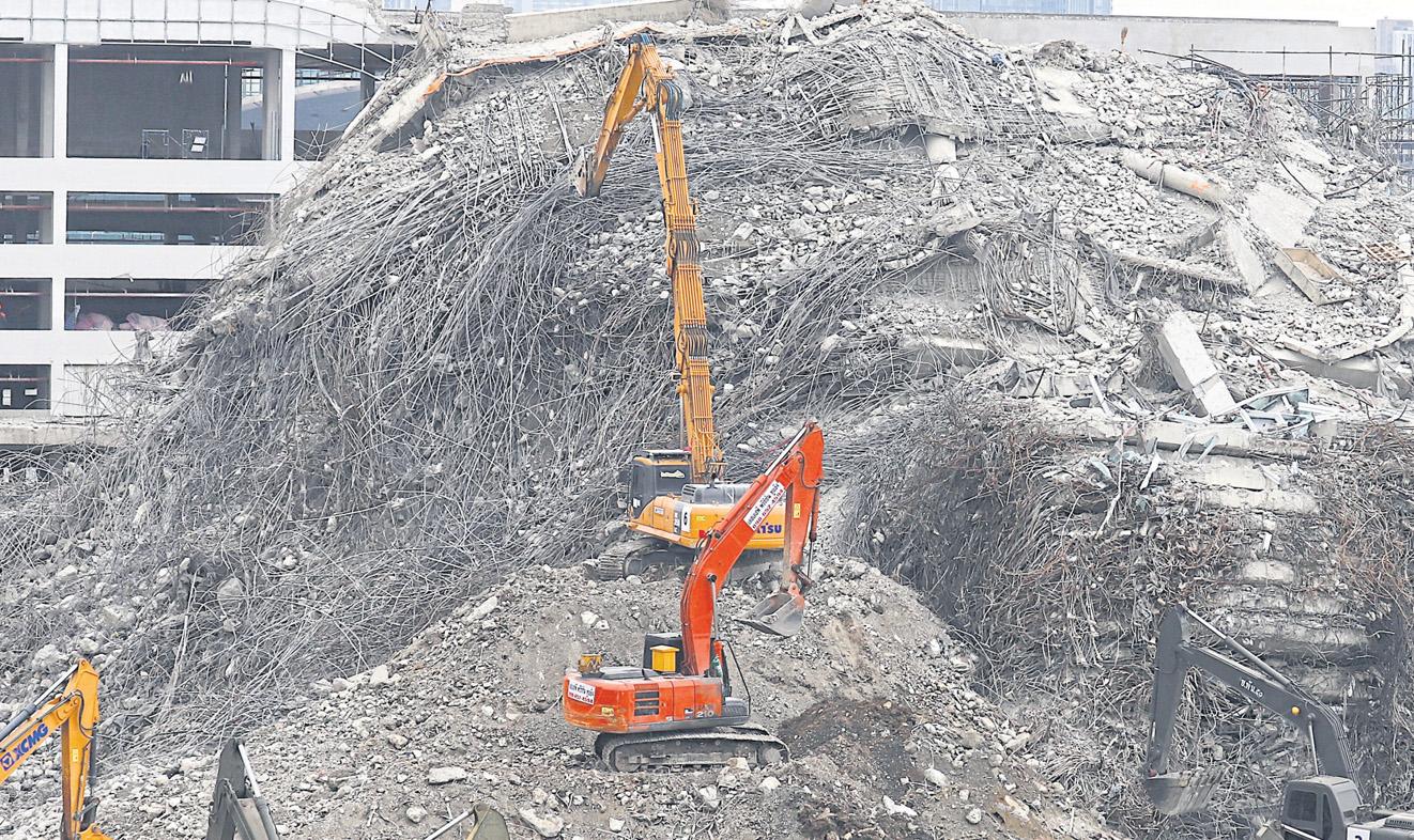 Agencies probe causes of building's collapse