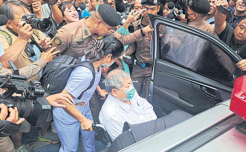 ITD boss Premchai reports to cops over tower collapse in wheelchair