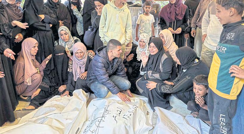 Military strikes Gaza after 'basic' food aid pledge, killing 22