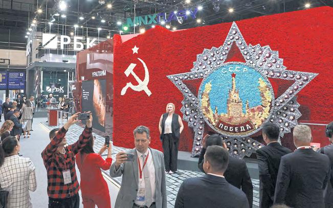 Putin T-shirts and robots – few Westerners – at Russian 'Davos'