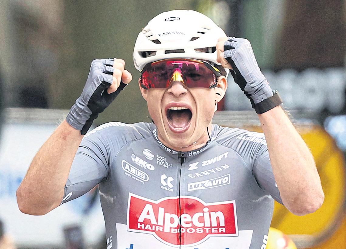 Belgian Philipsen wins windy opener