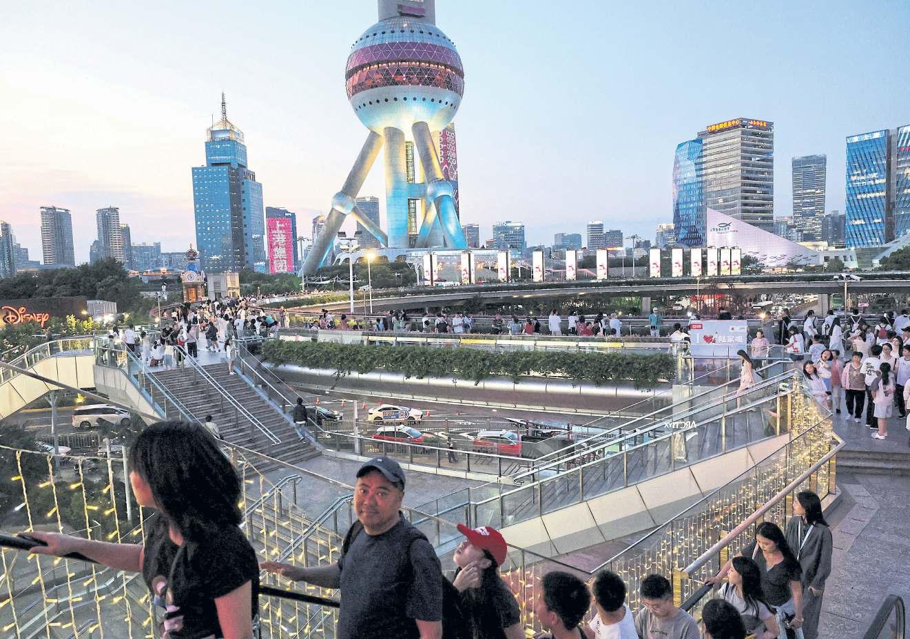 China’s economy slows as people spend less