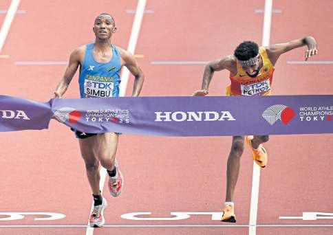 First-ever Tanzanian gold as Simbu dips past Petros