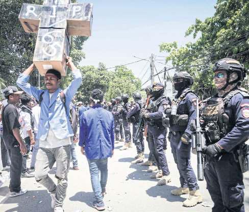 Tear gas fired as protests enter second day